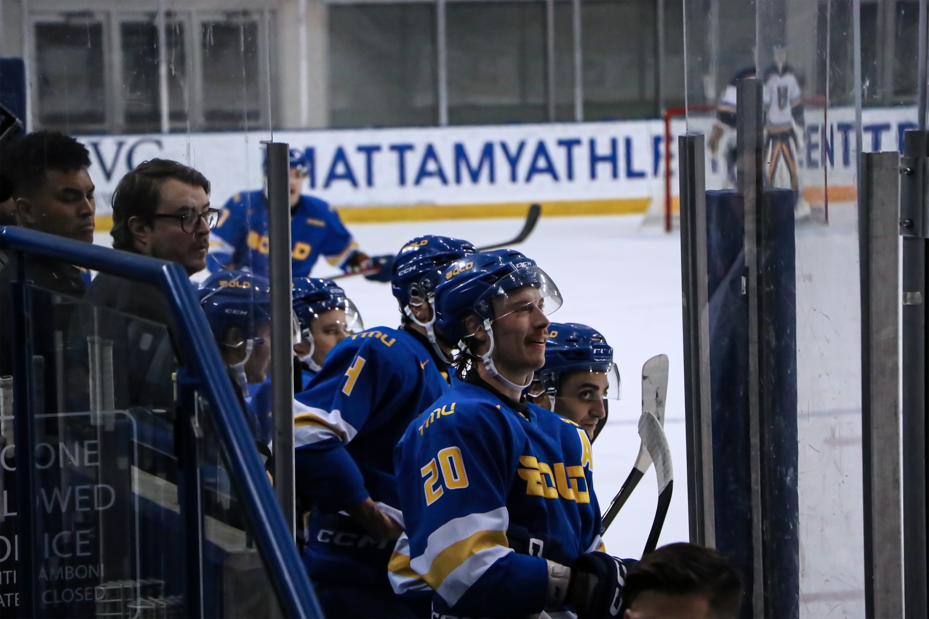 The TMU bench looks onto the ice