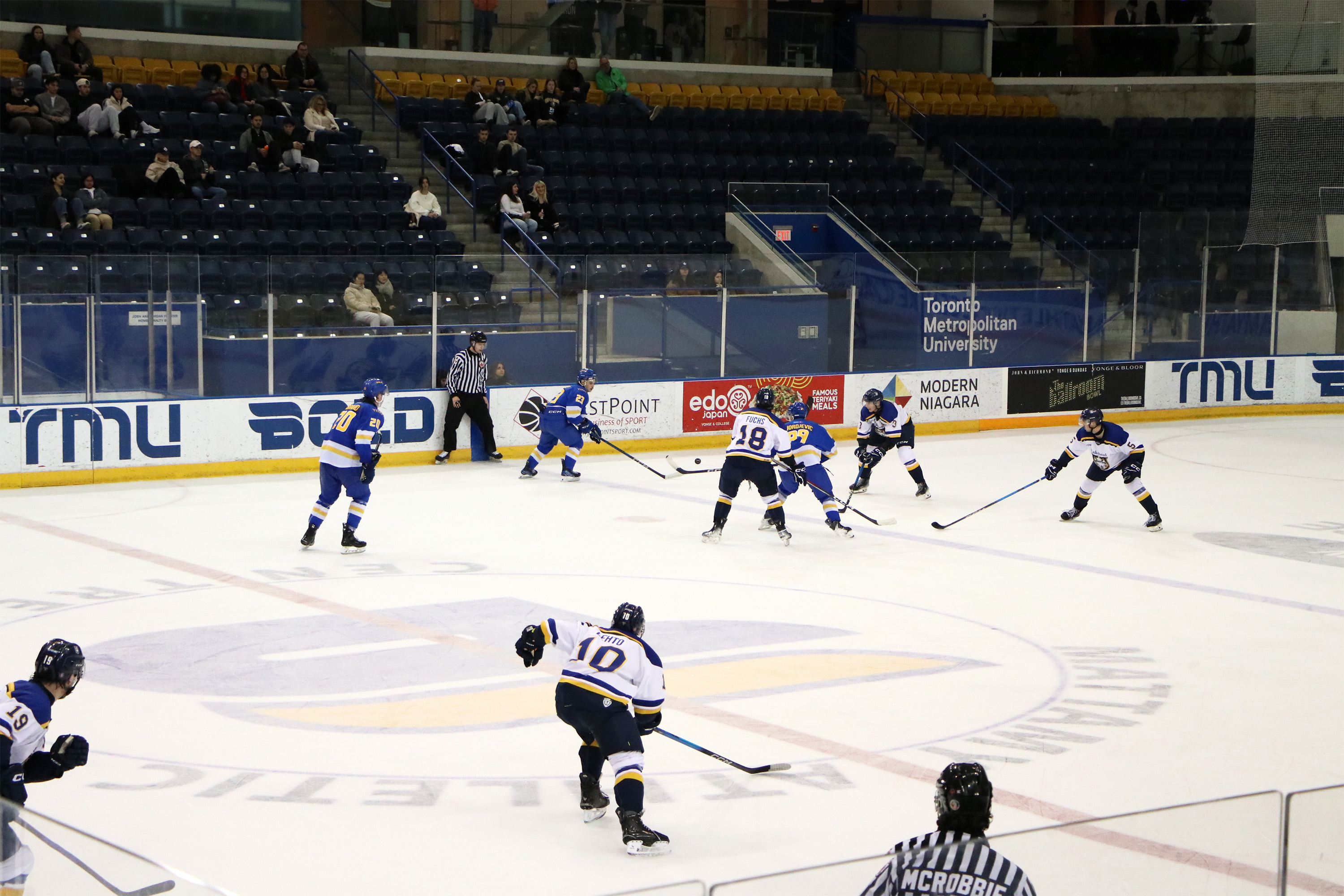 TMU and Lakehead battle for the puck