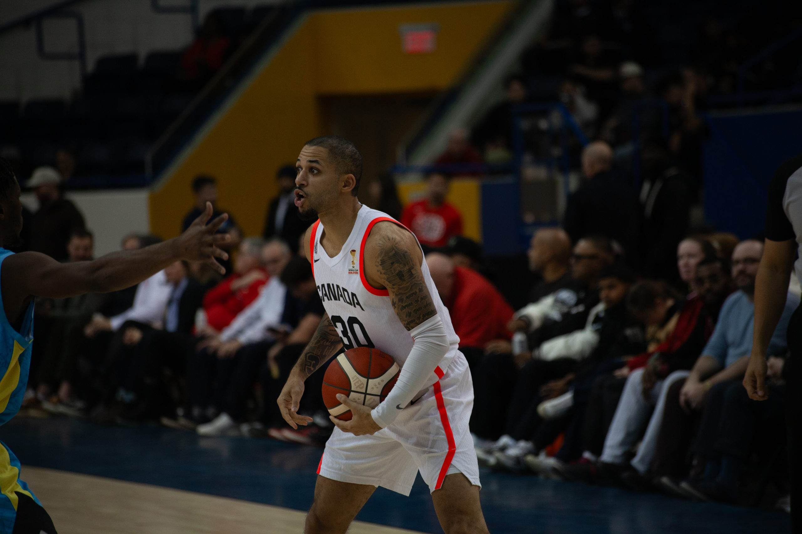 Kassius Robertson setting up a play at the top of the three point line