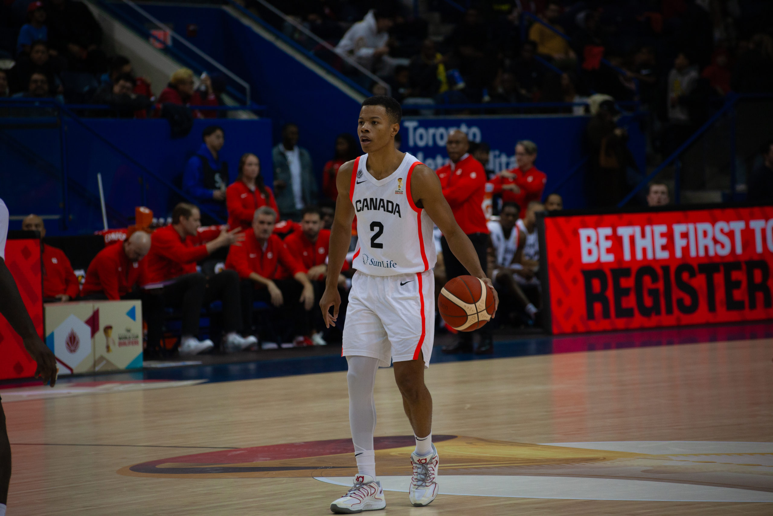 Trae Bell-Haynes dribbling the ball up the court at the Mattamy Athletic Centre