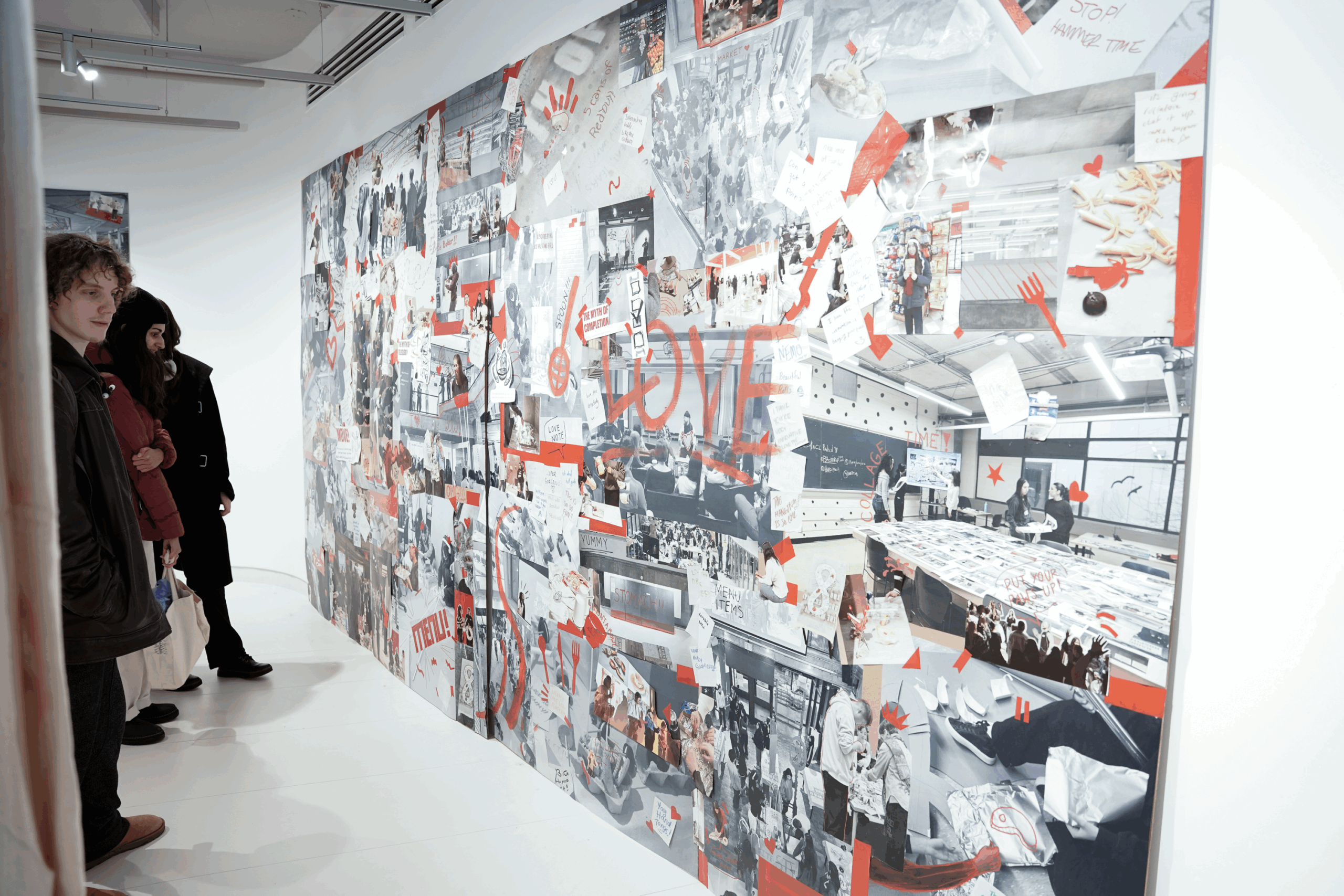 The wall of an art gallery holds a collage-like mural with red paint all over it.