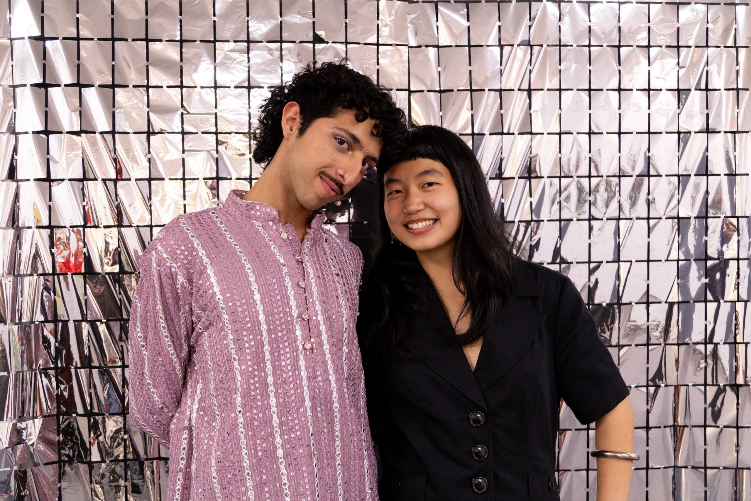 Arjun Kalra and Daibei Wang posing infront of a reflective background.