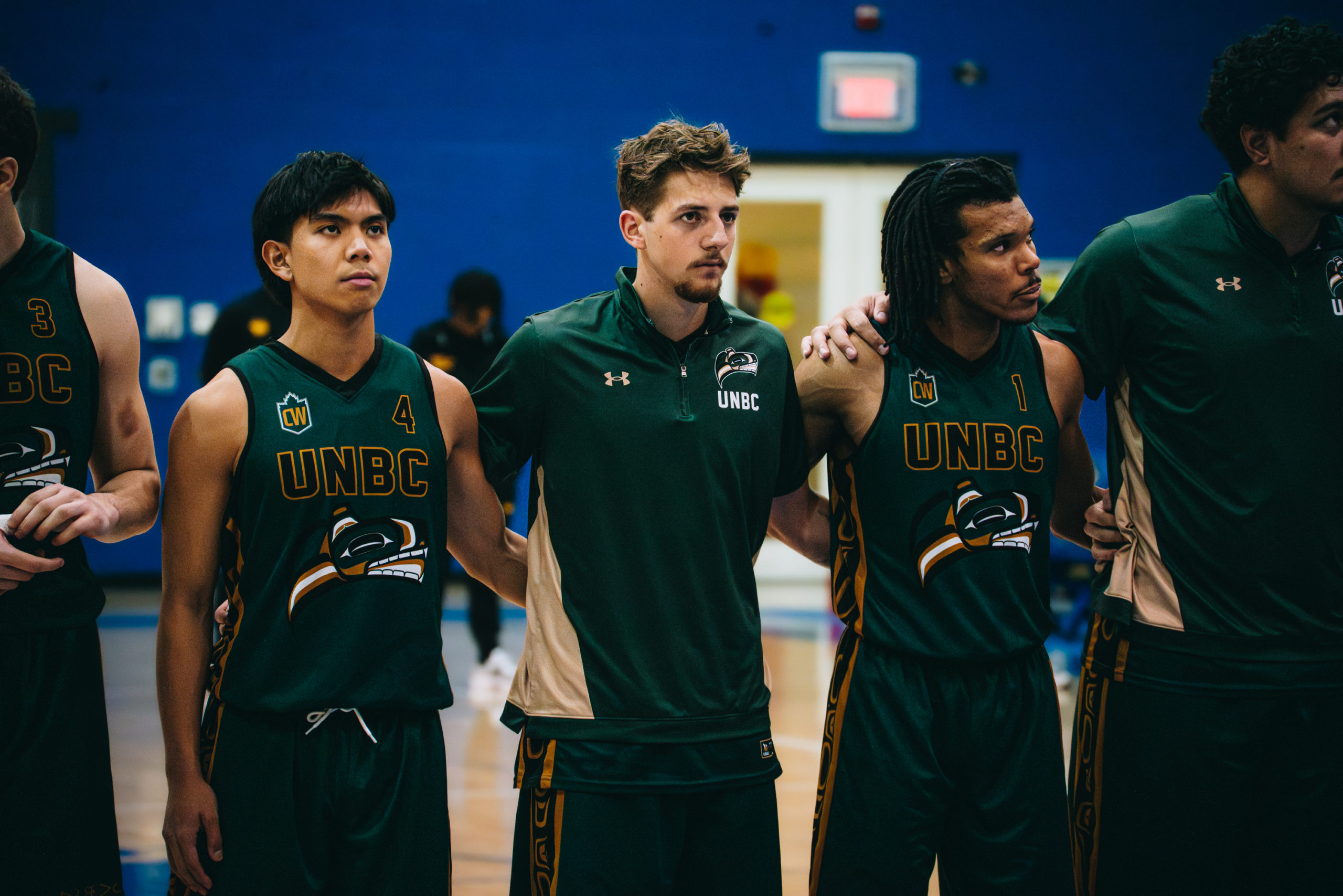 UNBC players line up for national anthem