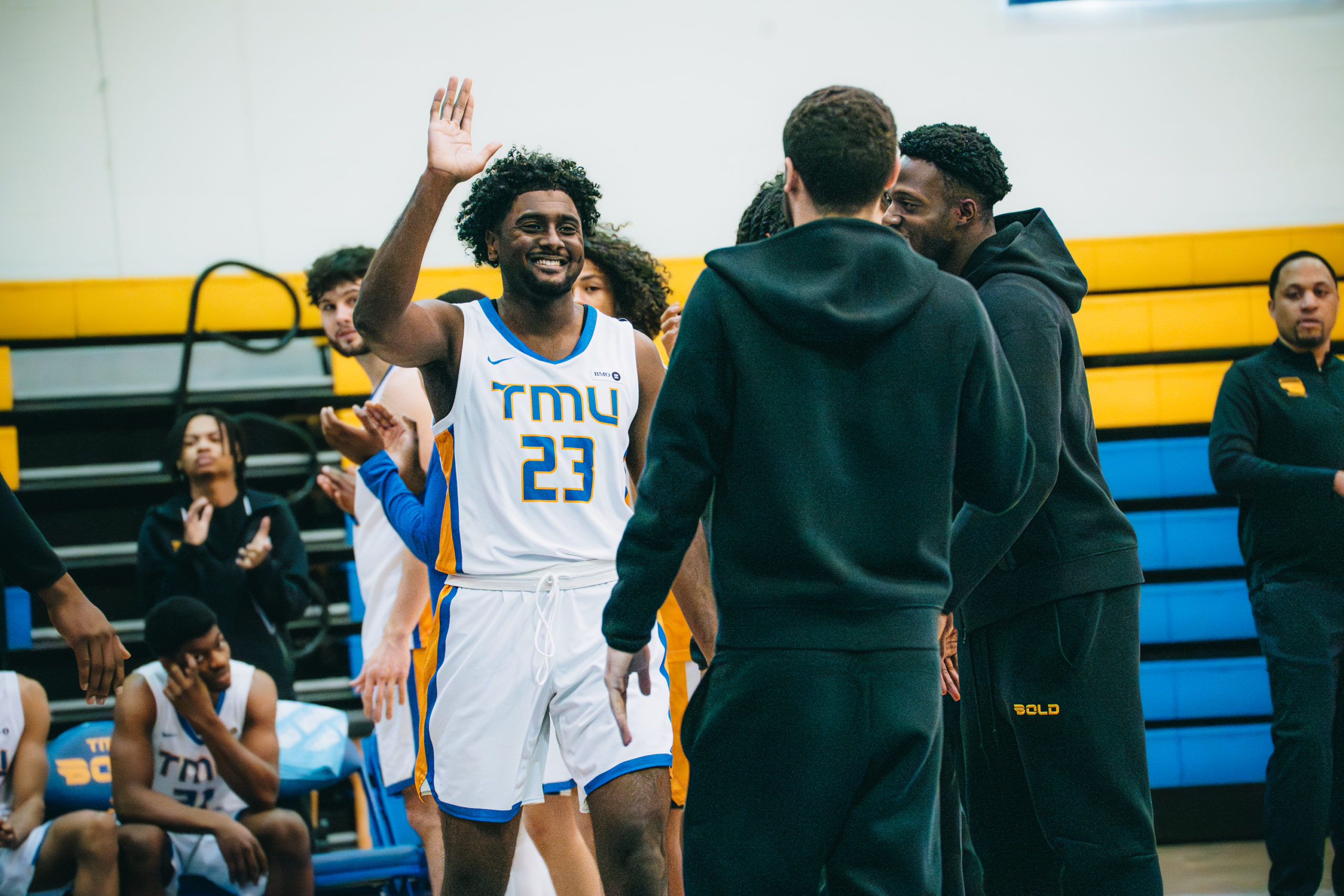 TMU Bold player goes through pre game intro