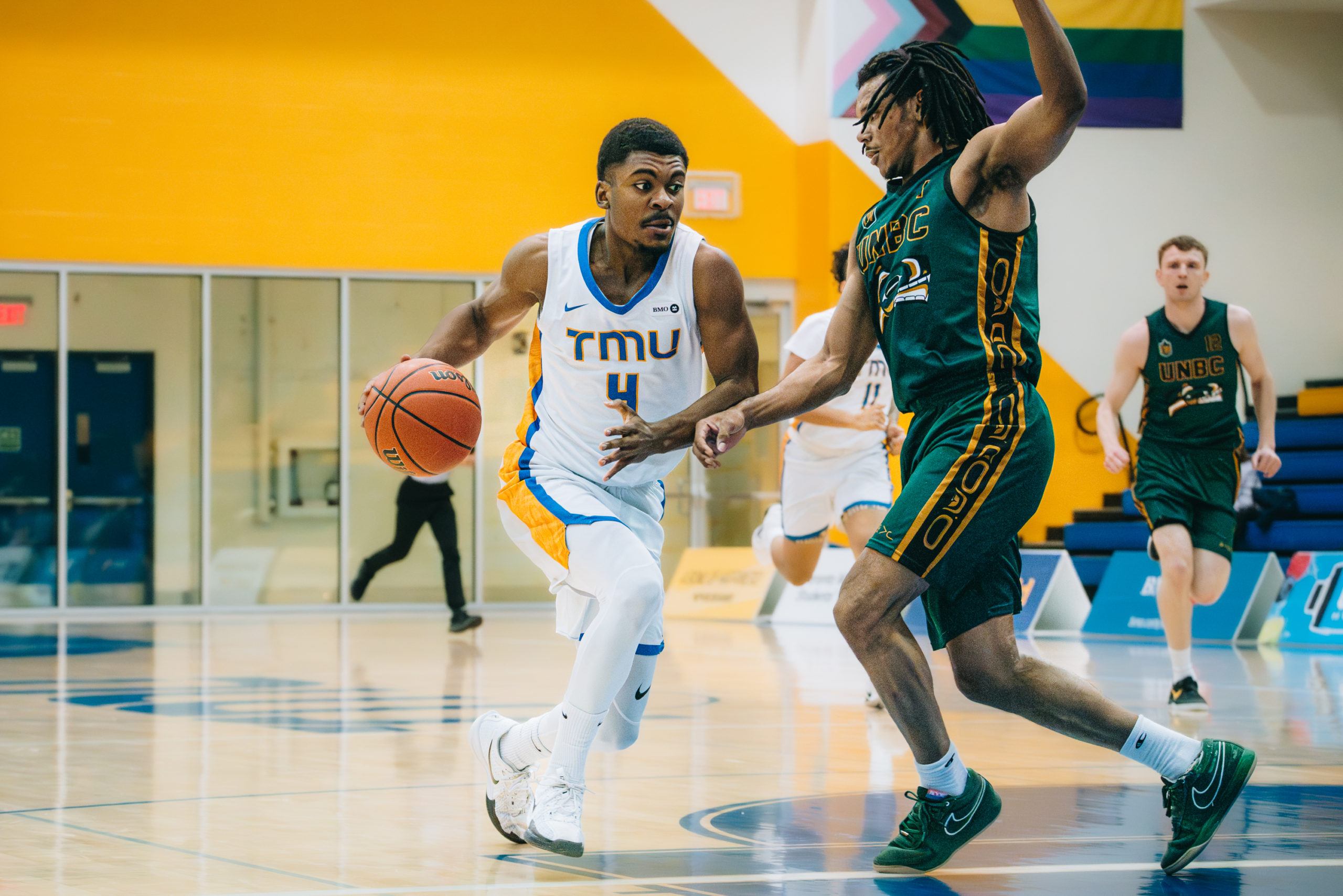 TMU player drives into the paint