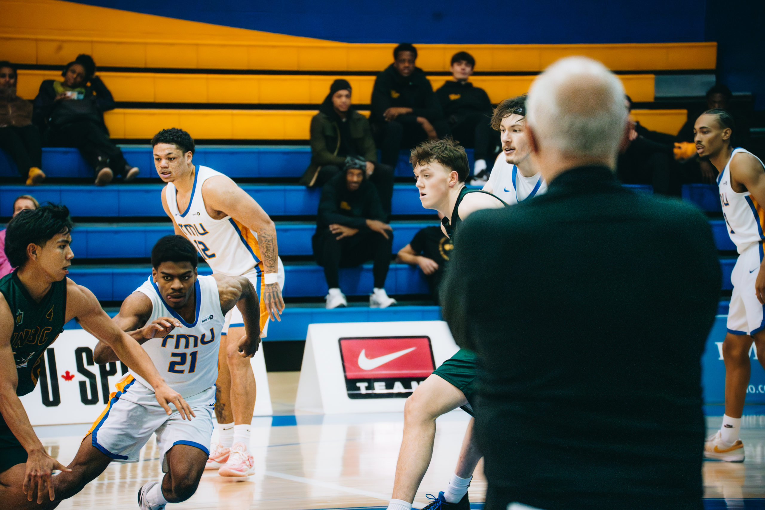 TMU coach watching a play unfold