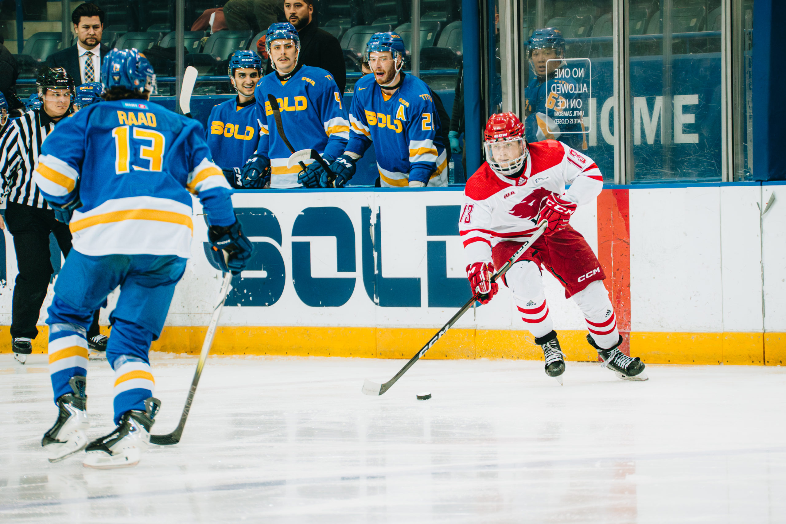 A York player controls possession of the puck amidst a TMU defender