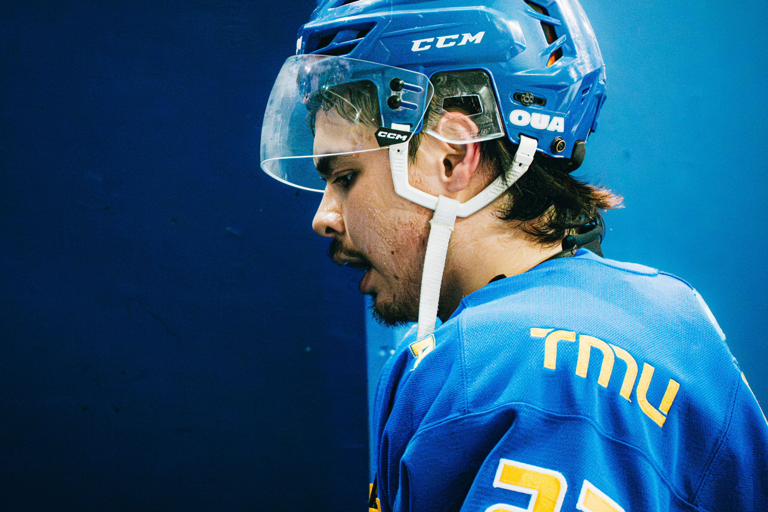 TMU Bold men's hockey player walking into the players' tunnel at the Mattamy Athletic Centre