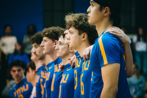 TMU stands shoulder to shoulder pre-game