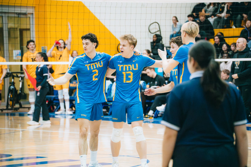 TMU huddles together after a point