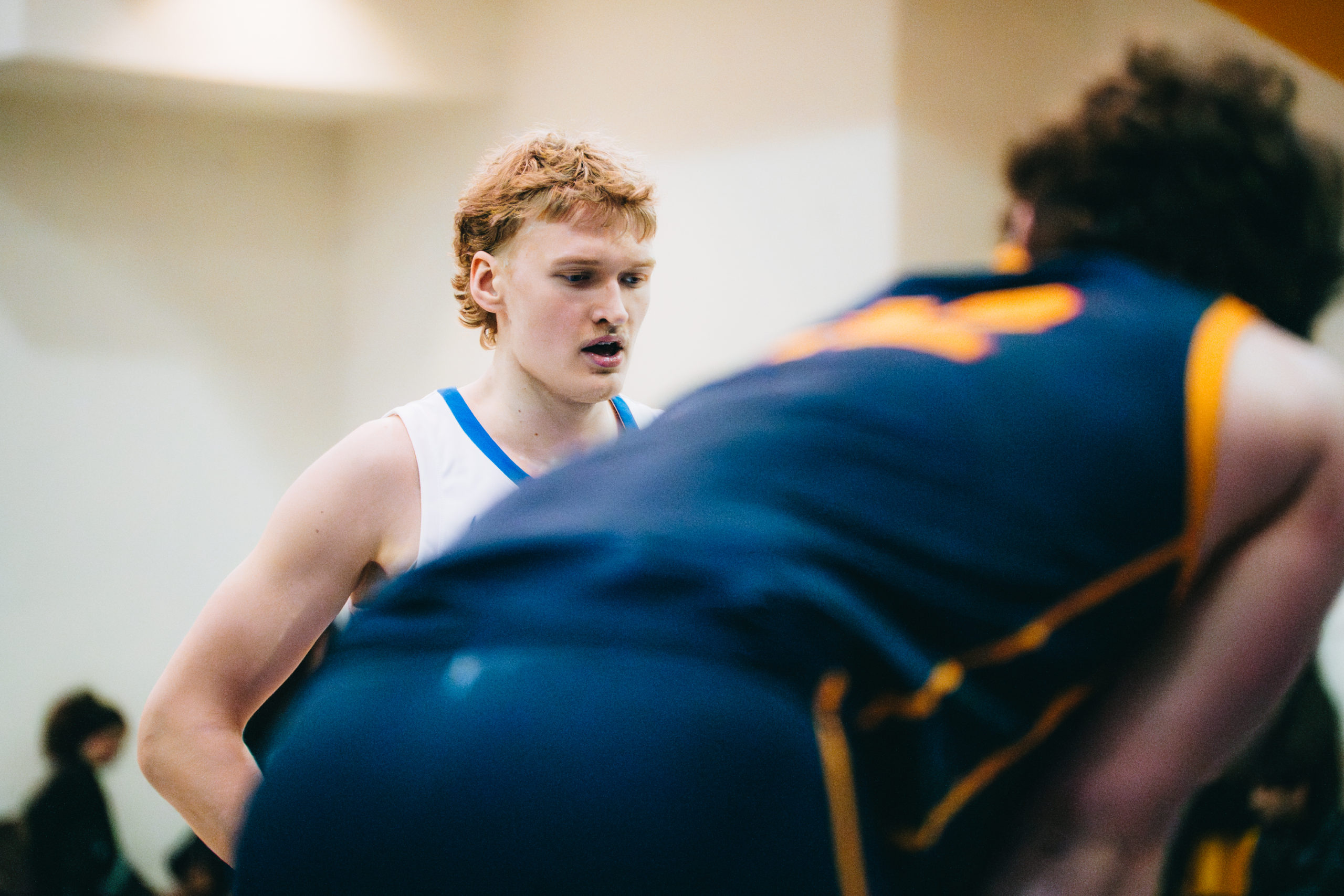 A TMU player focuses on the court ahead of him