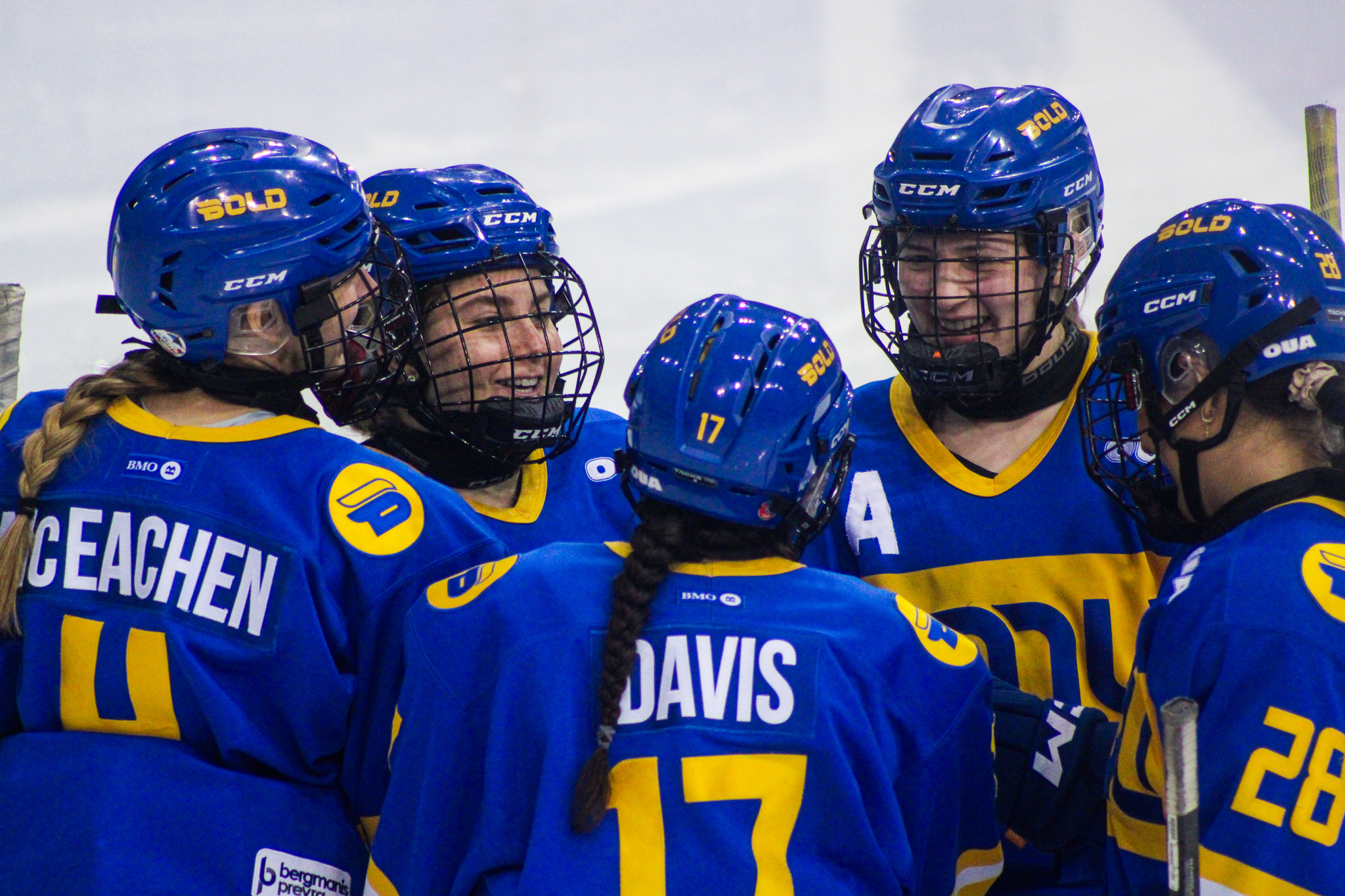 TMU's line-up huddles together on the ice