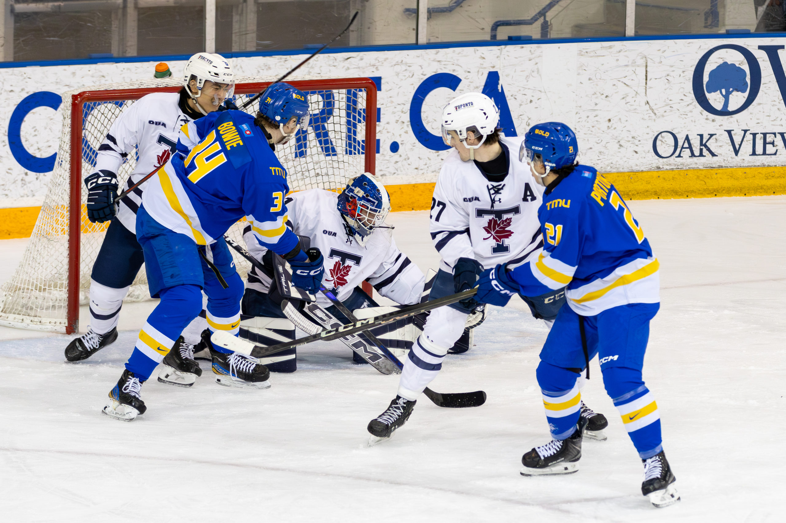 U of T defends their net as TMU gets a close offensive chance