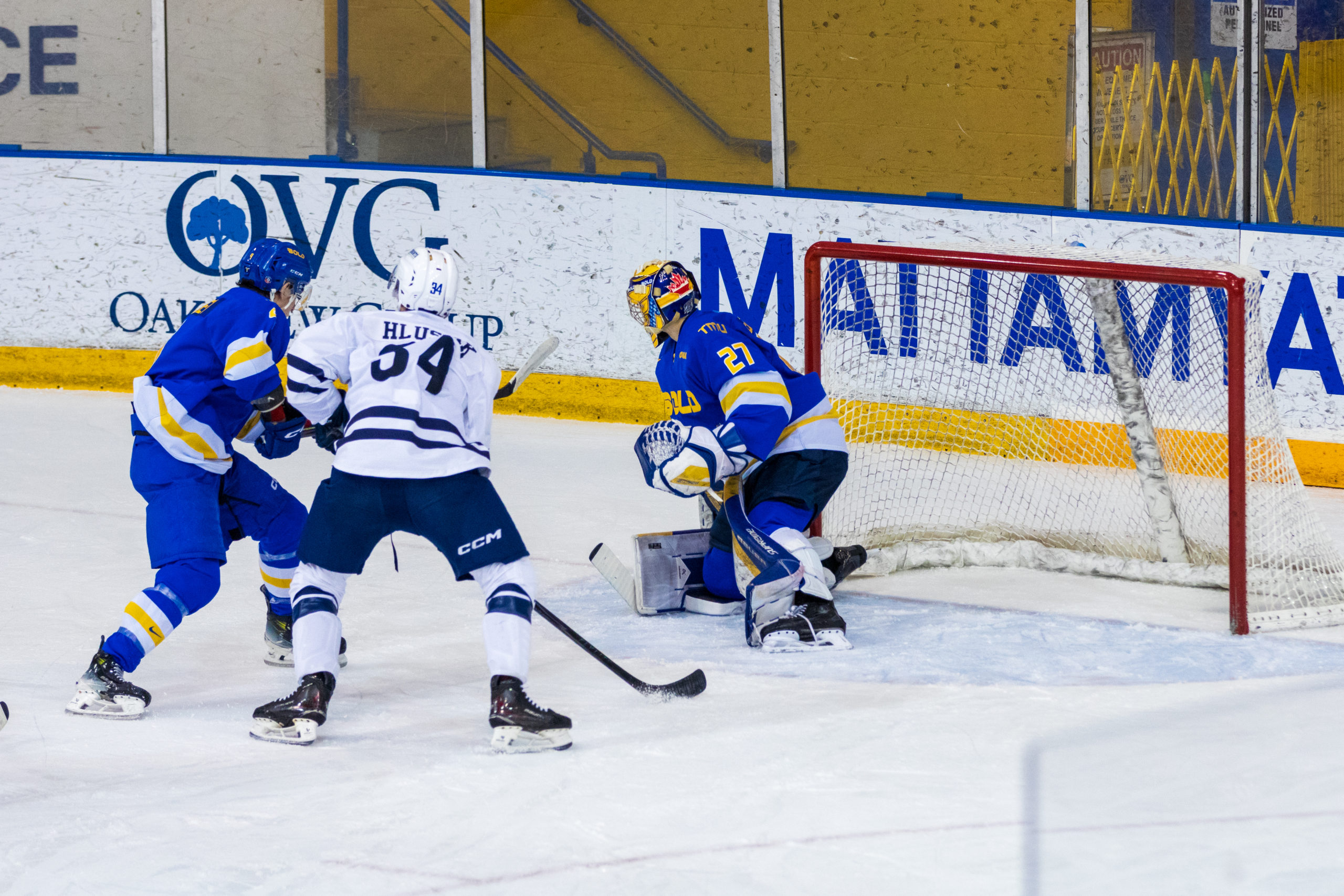 TMU defends their net as U of T gets a close offensive chance