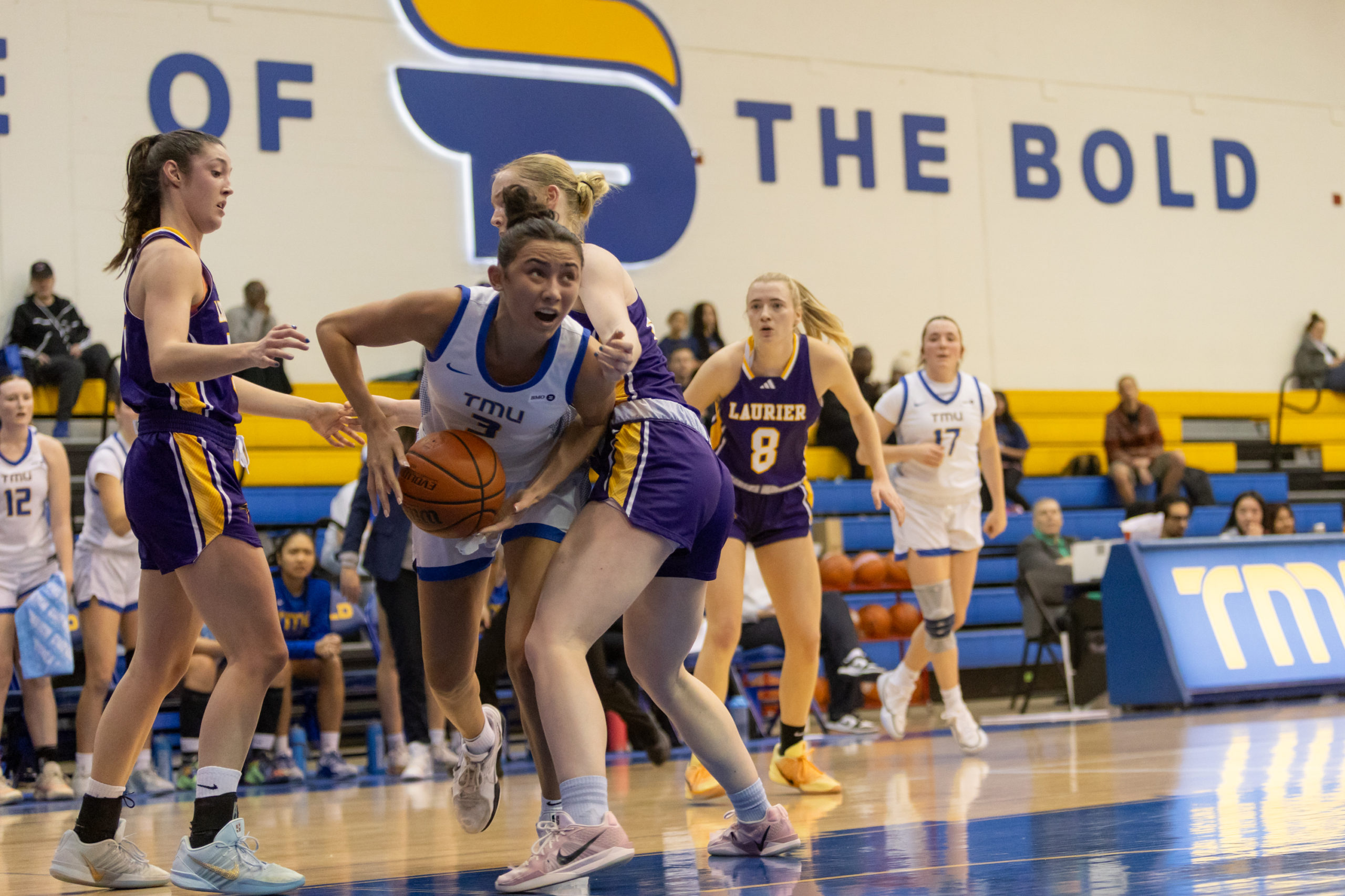 TMU maintains possession amidst pushy Laurier defenders
