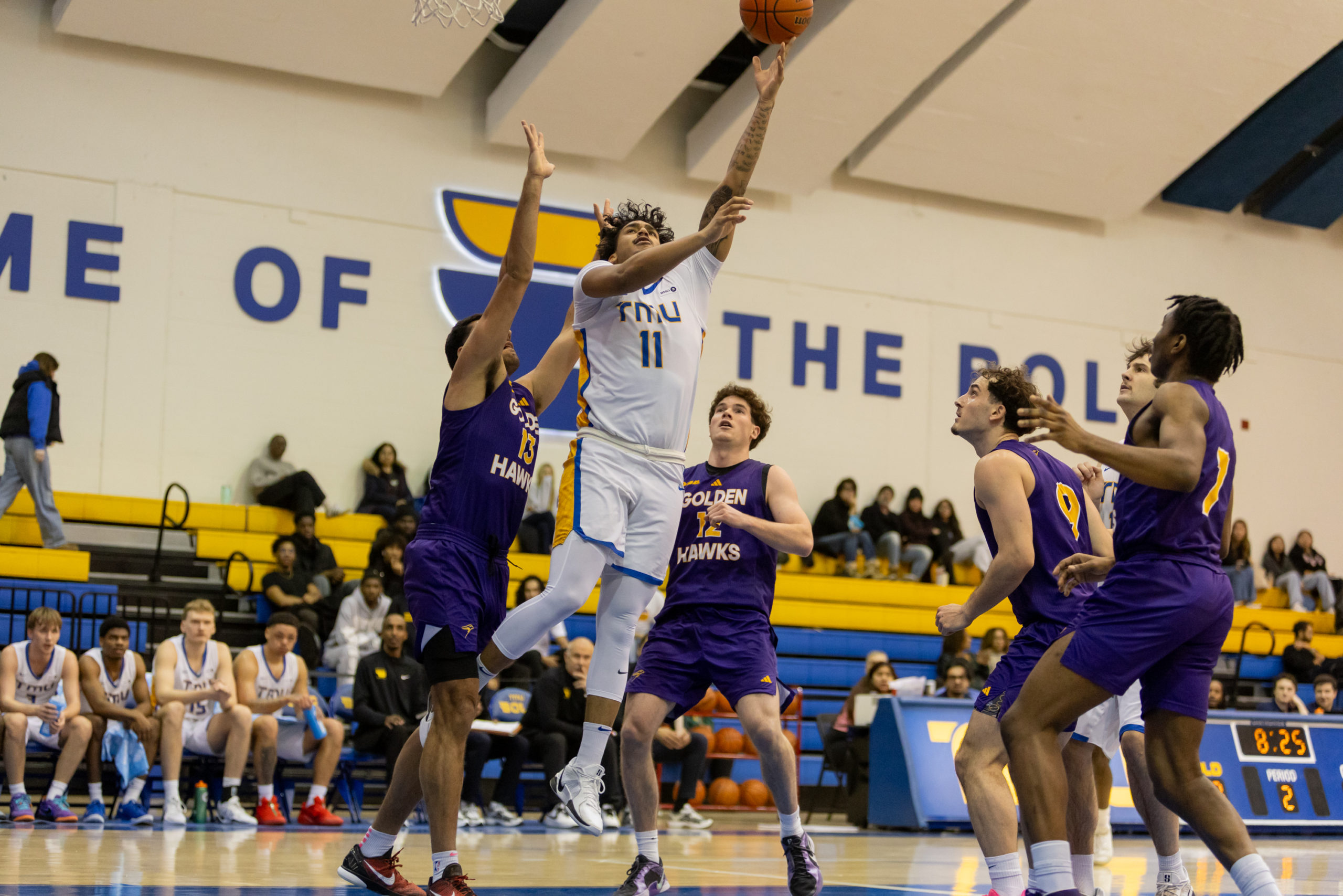 TMU PLAYER ATTEMPTS LAYUP
