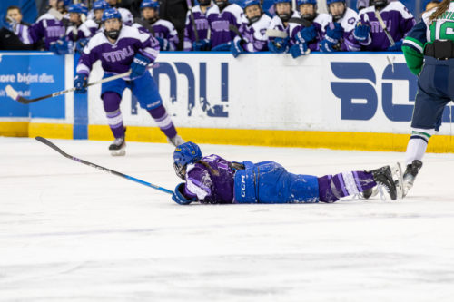 TMU women’s hockey player belly down on the ice after a position with at the Mattamy Athletic Centre