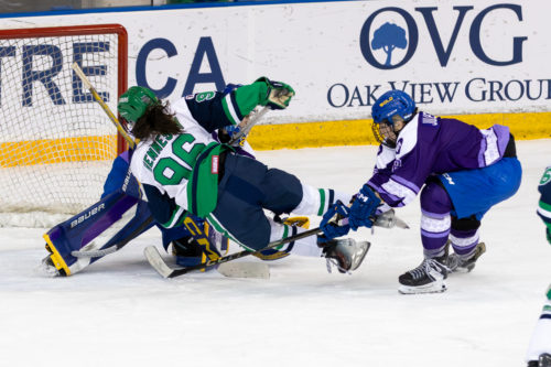 A Nipissing women’s hockey player dives for a goal attempt in front of TMUS goal at the Mattamy Athletic Centre