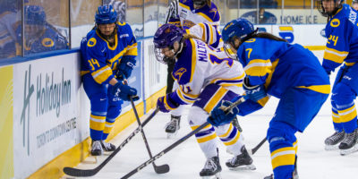 TMU players battling for the puck