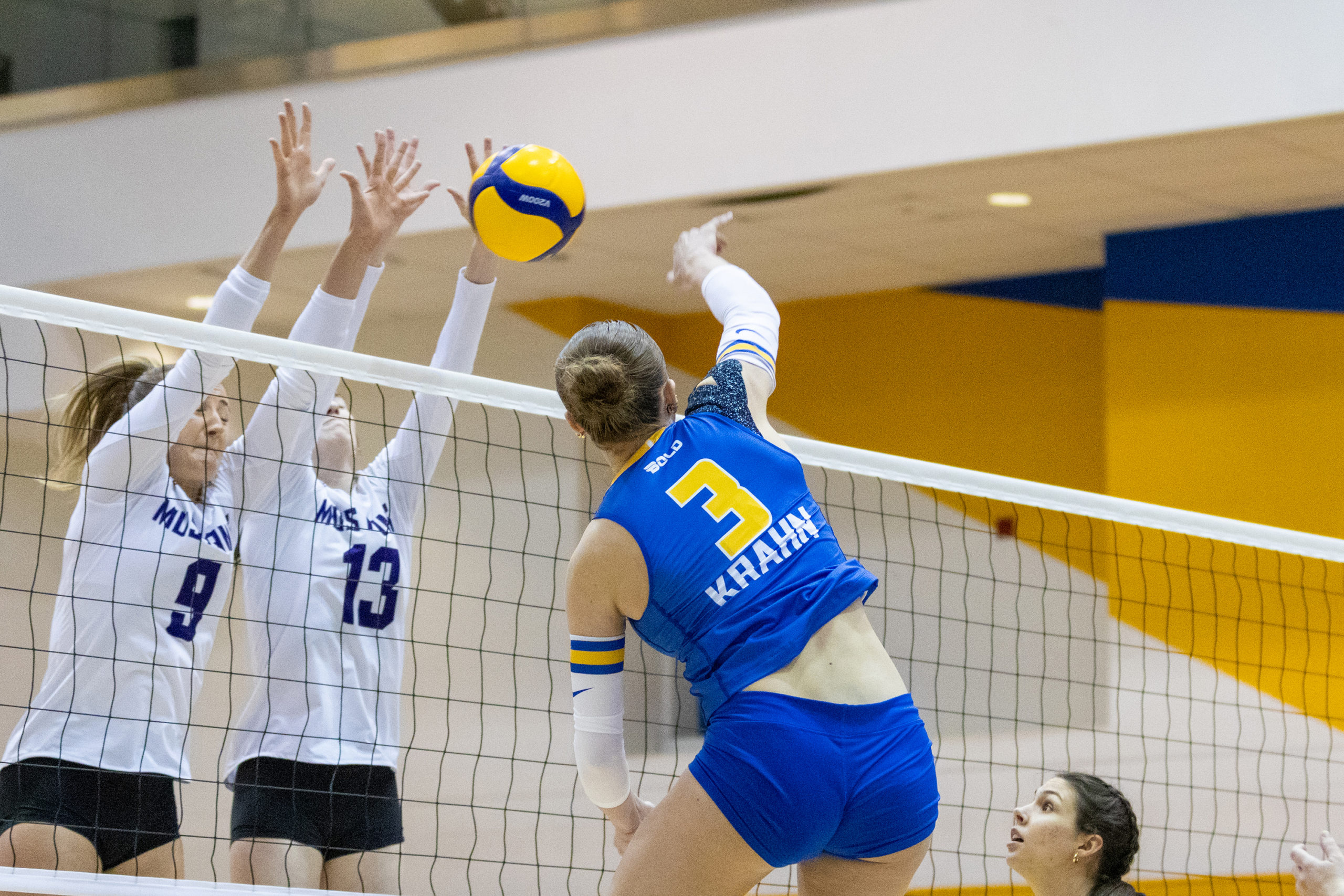 Western's front line successfully blocks a hit from TMU