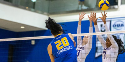 TMU sends the ball between Western blockers