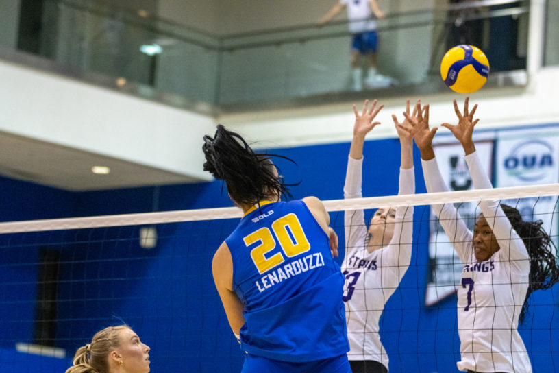 TMU sends the ball between Western blockers