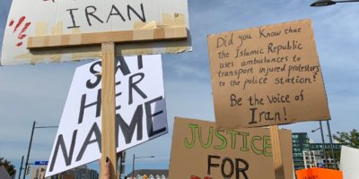 A group of protesters in Richmond Hill on Oct. 1 2022 holding up signs in support of the people of Iran, against the Islamic Republic.