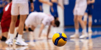 A volleyball bounces on RMC's side of the court as the team after TMU gains a point