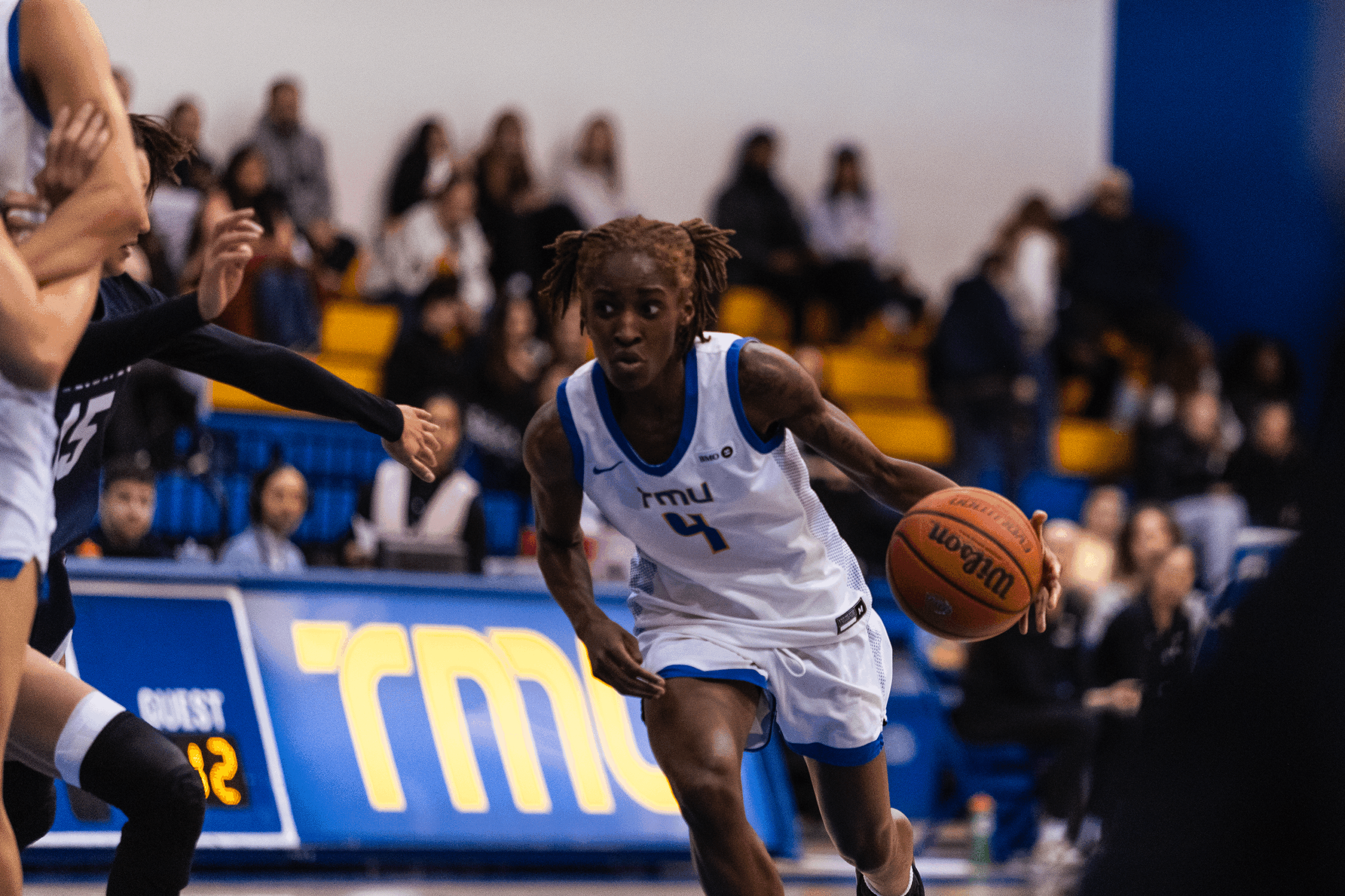 Myriam Kone maintains possession of the ball as she eyes the court ahead of her