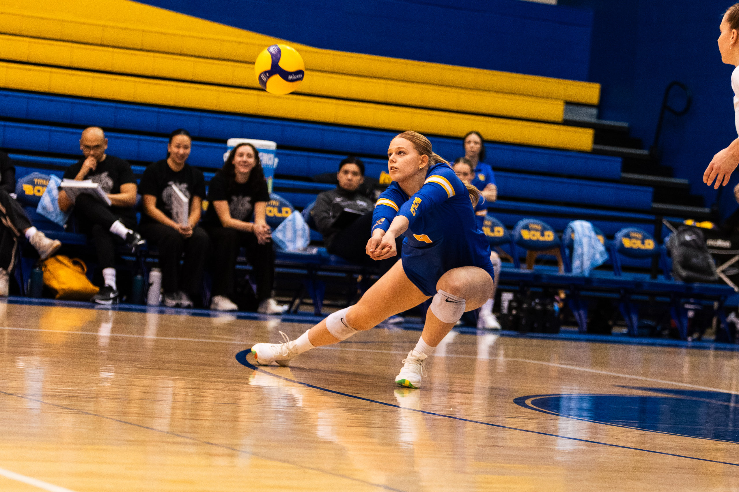 A TMU player moves across the court to receive the ball