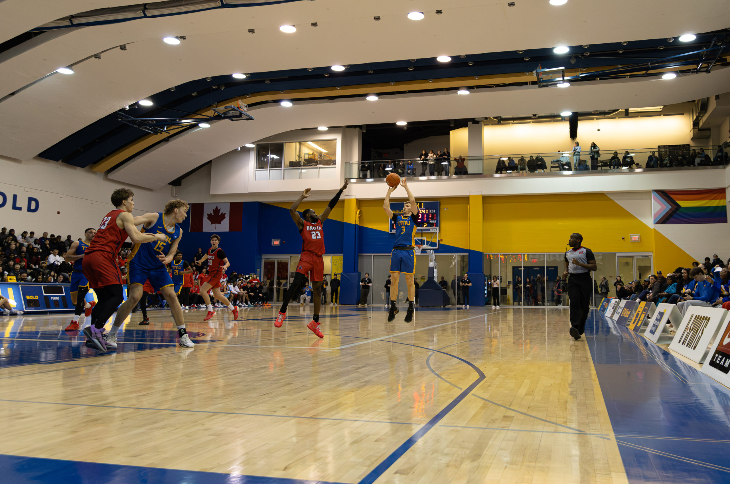 Kevin Toth shooting a contested three pointer