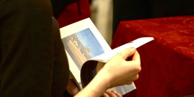 Someone flipping through a book.