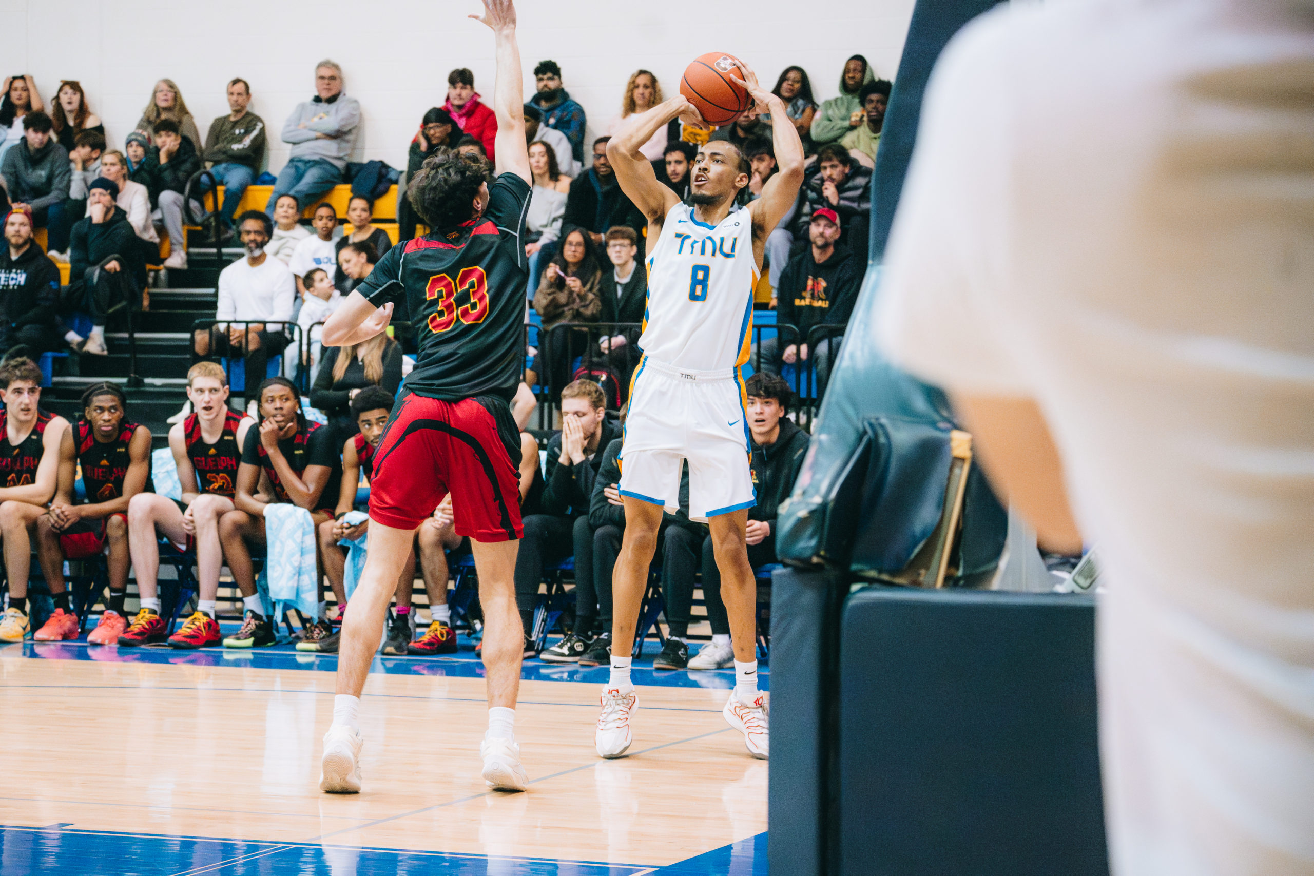 A TMU player prepares to pass