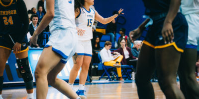 A TMU player makes a signal to her teammates
