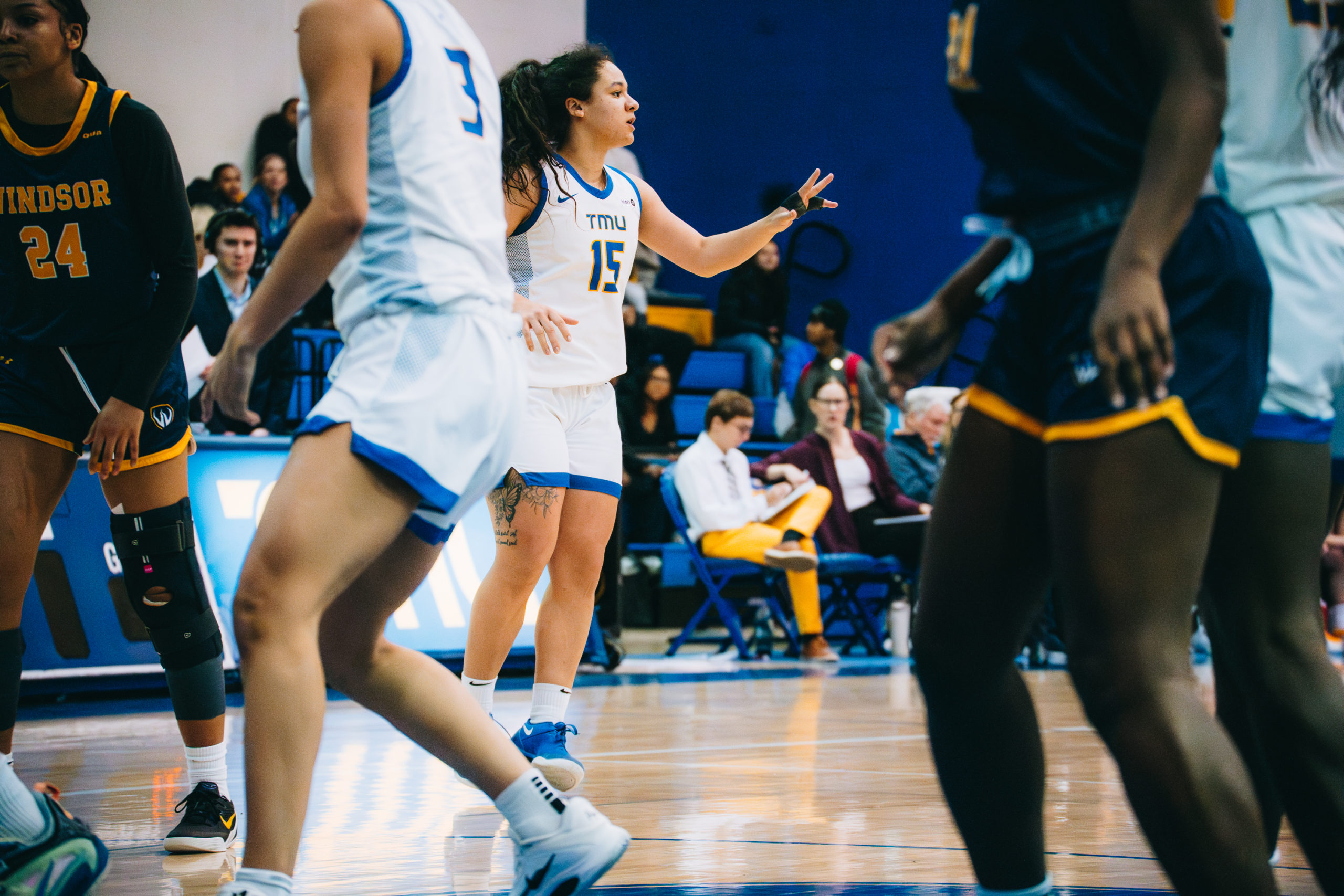 A TMU player makes a signal to her teammates