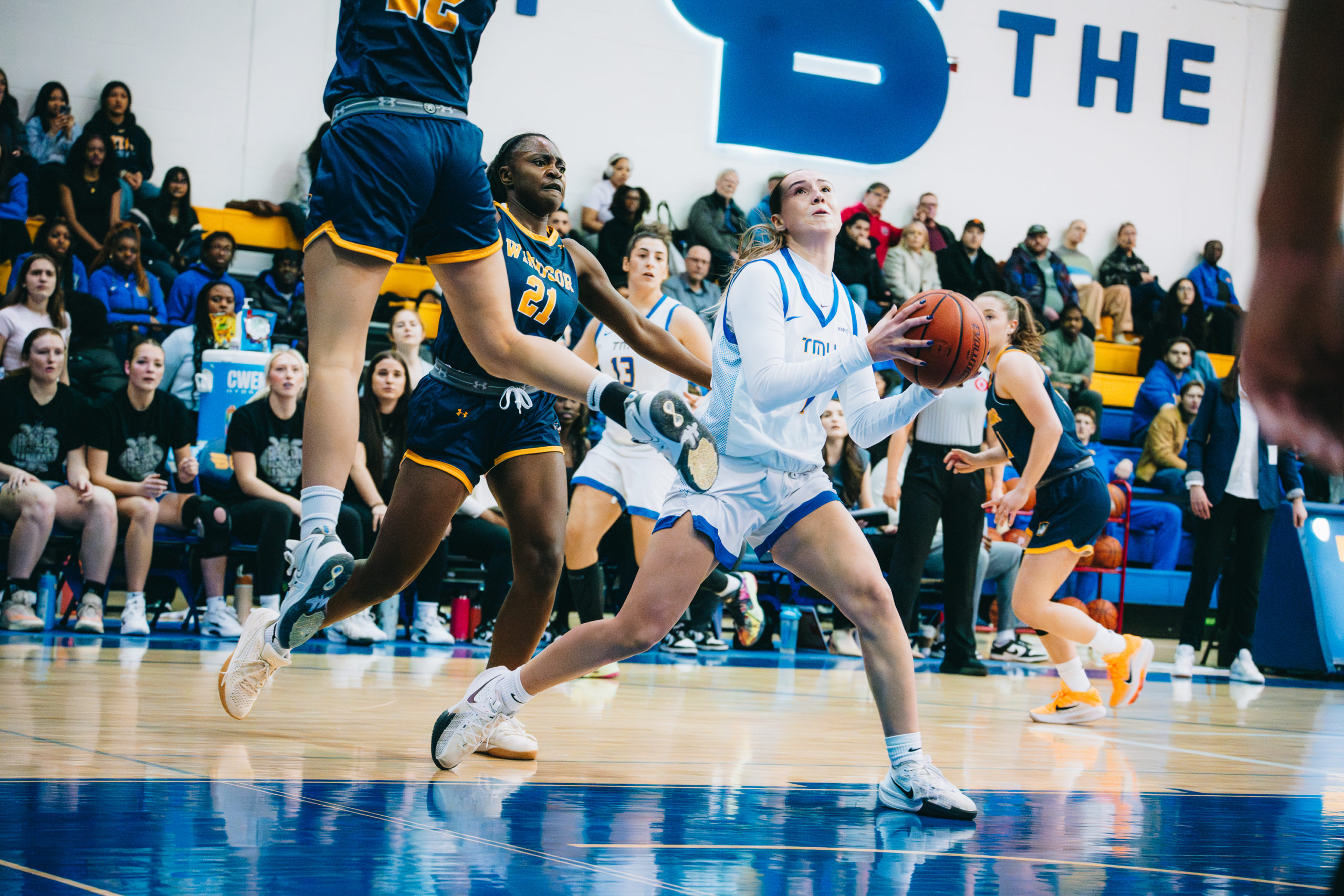 A TMU player prepares to make a shot amidst Windsor defenders