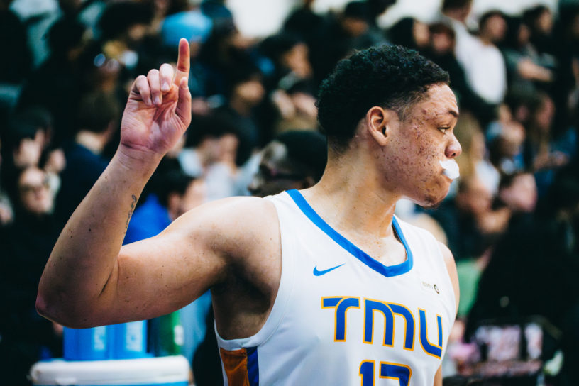 Aaron Rhooms signals a message to his team with his pointer finger