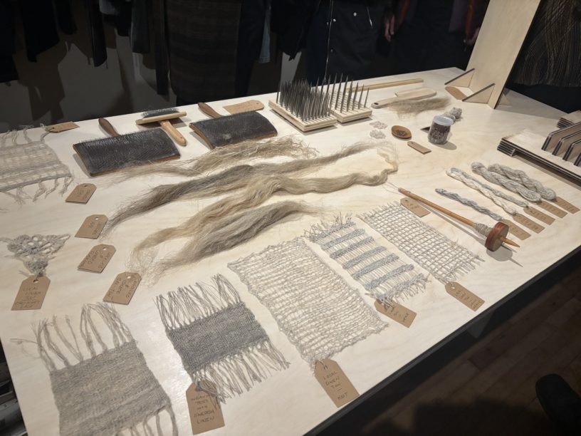 Linen fabric samples and tools for making linen from flax at The Flax Project exhibition.