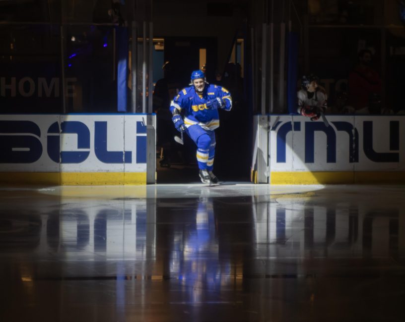 TMU Men's hockey player enters the ice at the Mattamy Athletic Centre