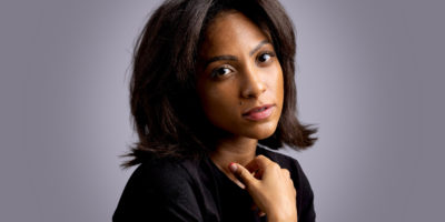 Naomi Cowan against a grey background.