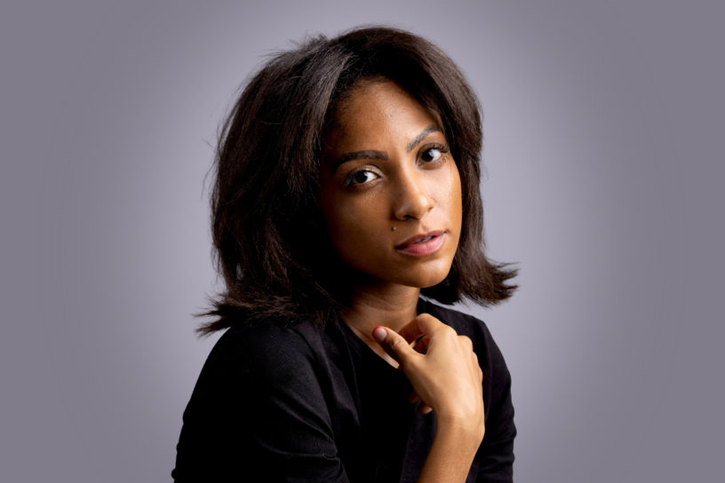 Naomi Cowan against a grey background.