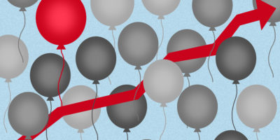 Graphic of a red arrow in the centre around grey balloons and one red balloon on the top left.
