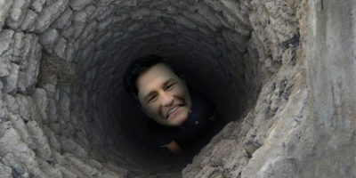Pierre Poilievre looking up from the bottom of a water well.