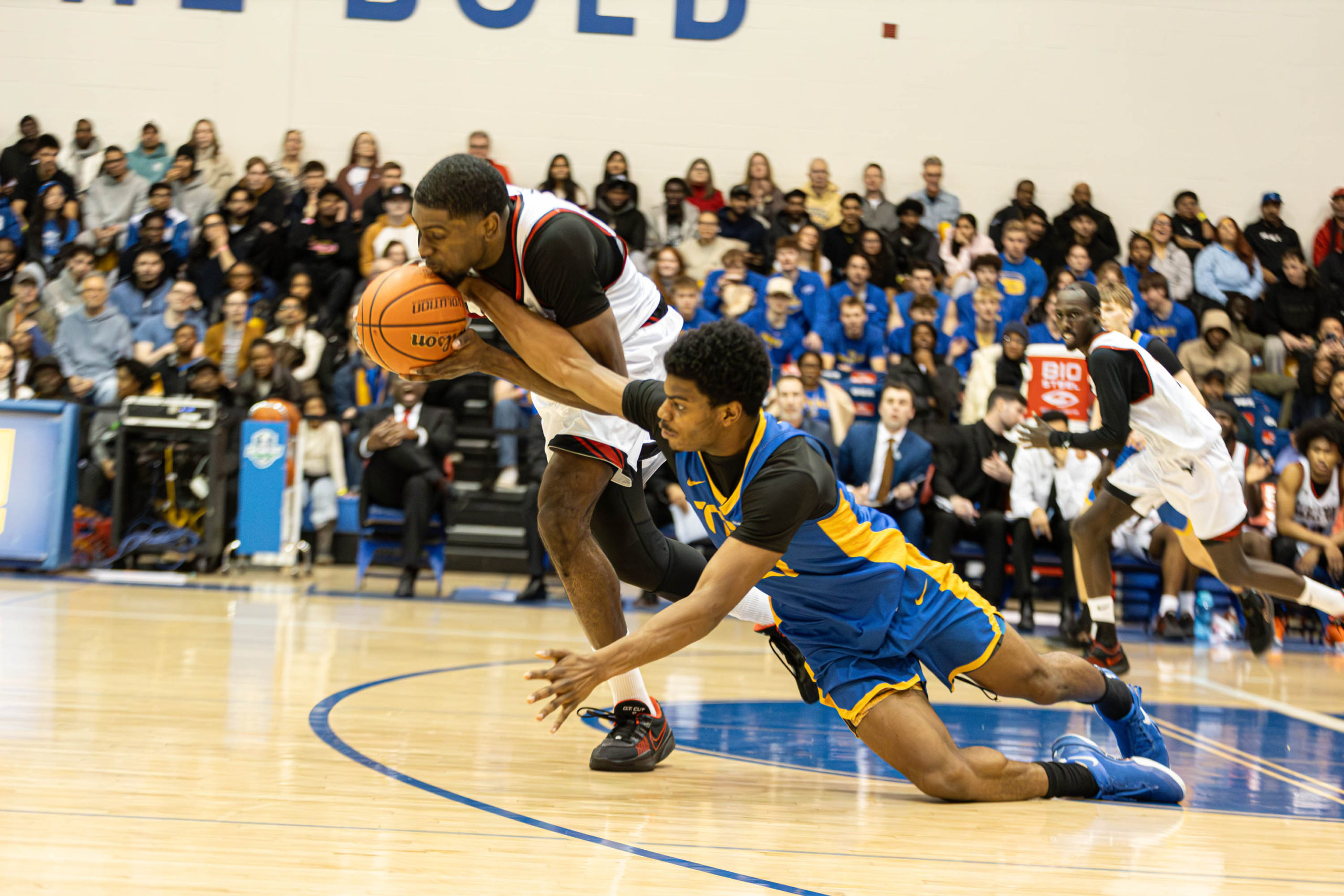 Gabriel Gutsmore goes for a diving steal at the Mattamy Athletic Centre
