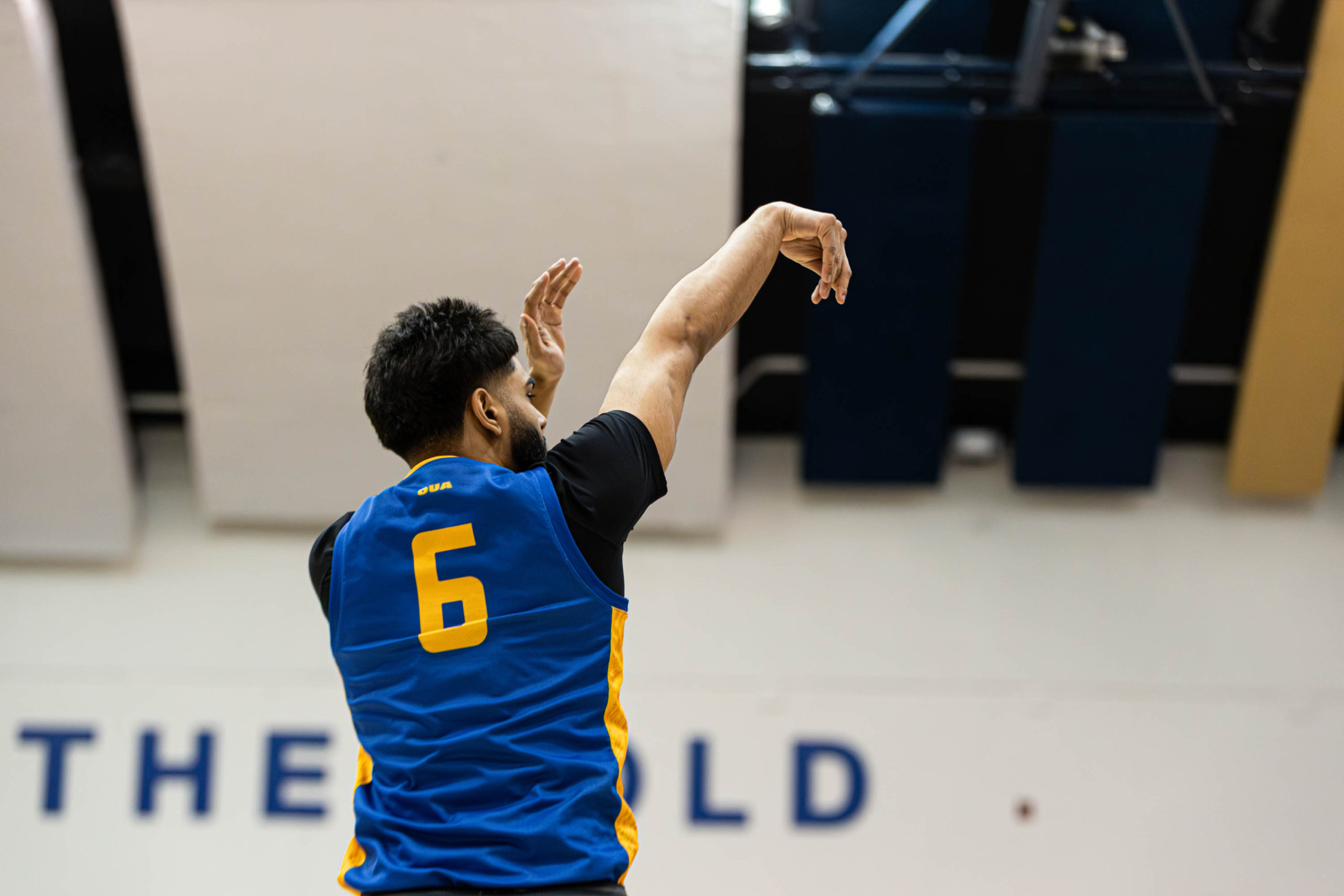 TMU Bold men's basketball player goes up for jump-shot at the Mattamy Athletic Centre
