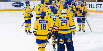 TMU celebrates on the ice after defeating Brock 2-1