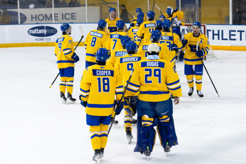 TMU celebrates on the ice after defeating Brock 2-1