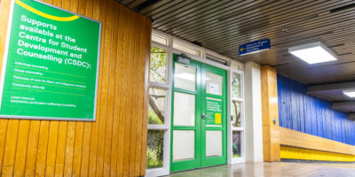 Photo of the hallway and door outside the Centre for Student Development & Counselling.