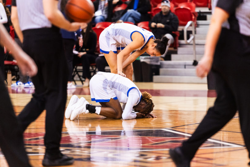 Myriam Kone on the floor after a injury to the face