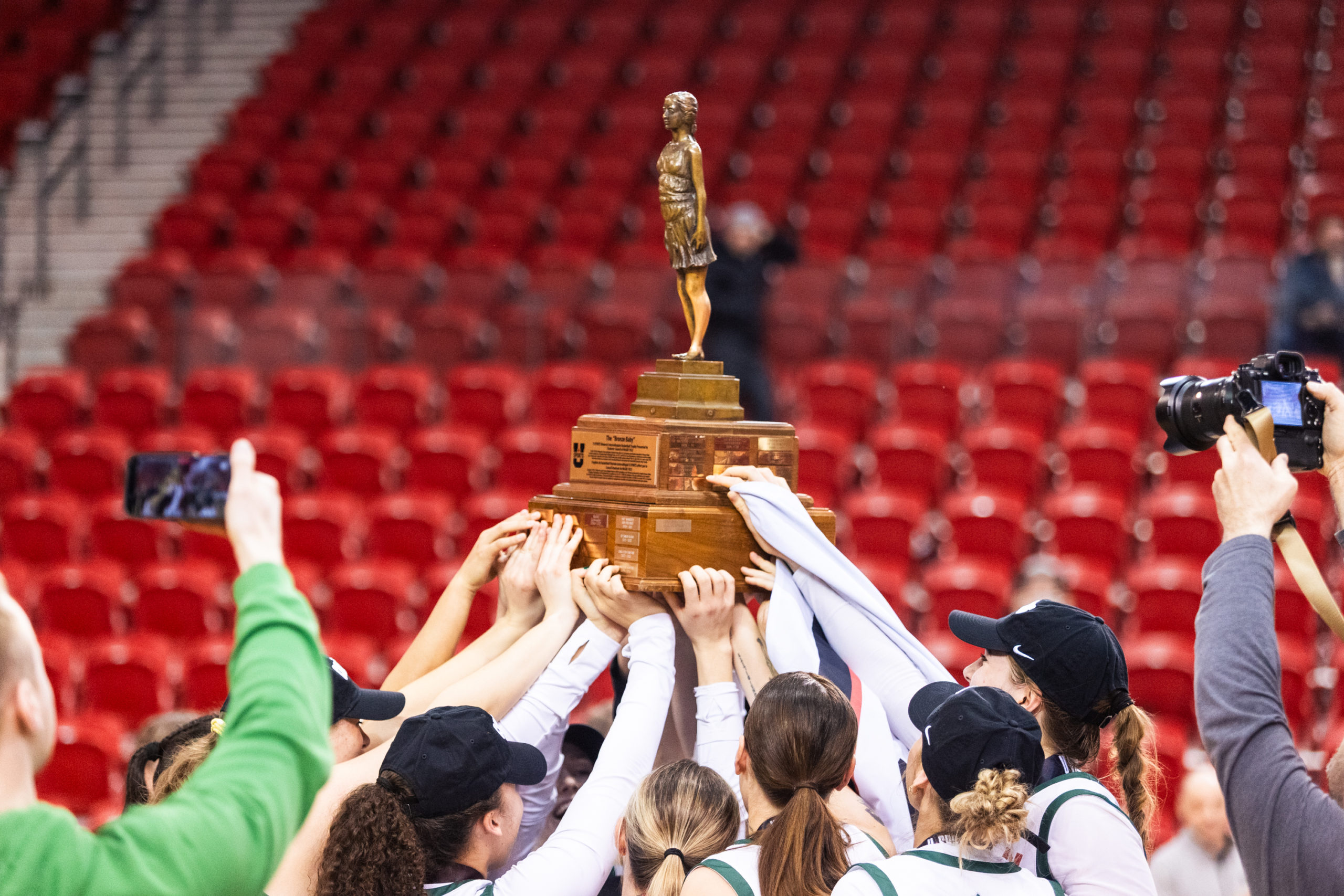 The Huskies hoist up the Bronze Baby after winning the U Sports Women's Final 8